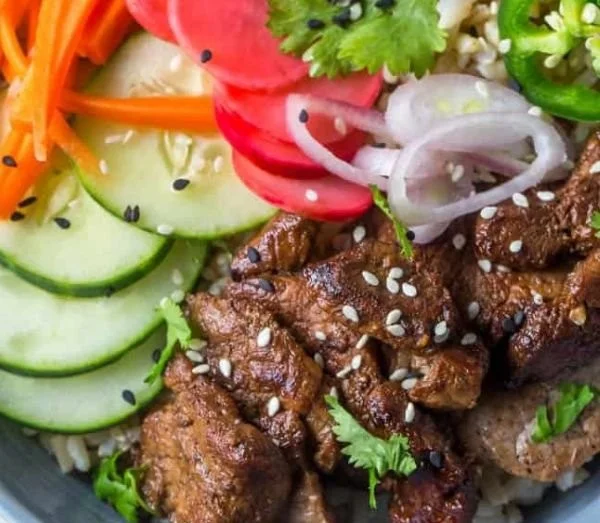 Banh Mi rice bowl with fresh vegetables and savory protein