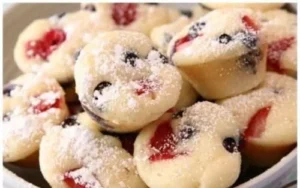 Delicious berry protein pancake bites stacked on a plate for a healthy snack.