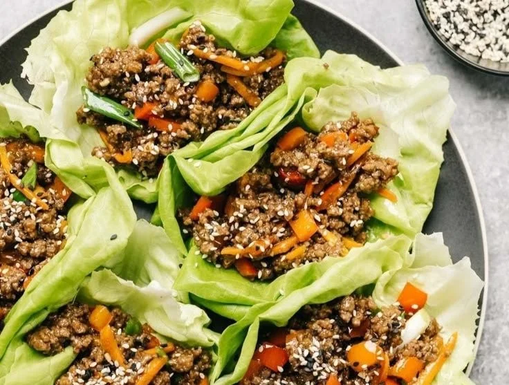 Ground beef lettuce wraps filled with fresh vegetables and seasonings