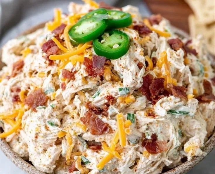 Keto Jalapeno Popper Chicken Salad in a bowl with toppings