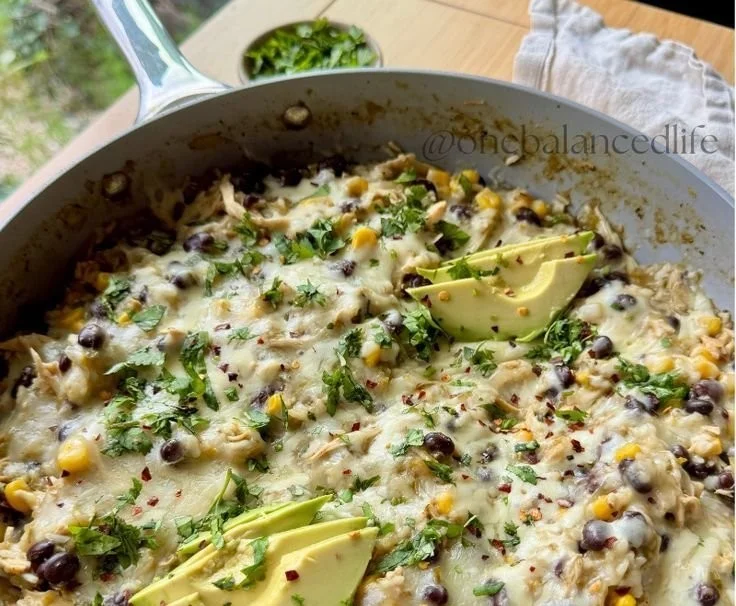 Salsa Verde Chicken and Rice Skillet served in a bowl with garnishes.