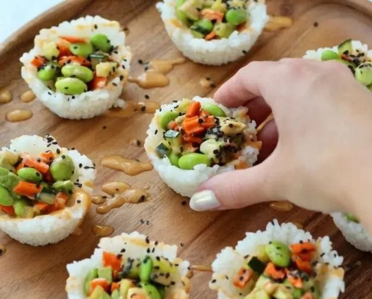 Delicious assortment of sushi cups filled with fresh seafood and vegetables